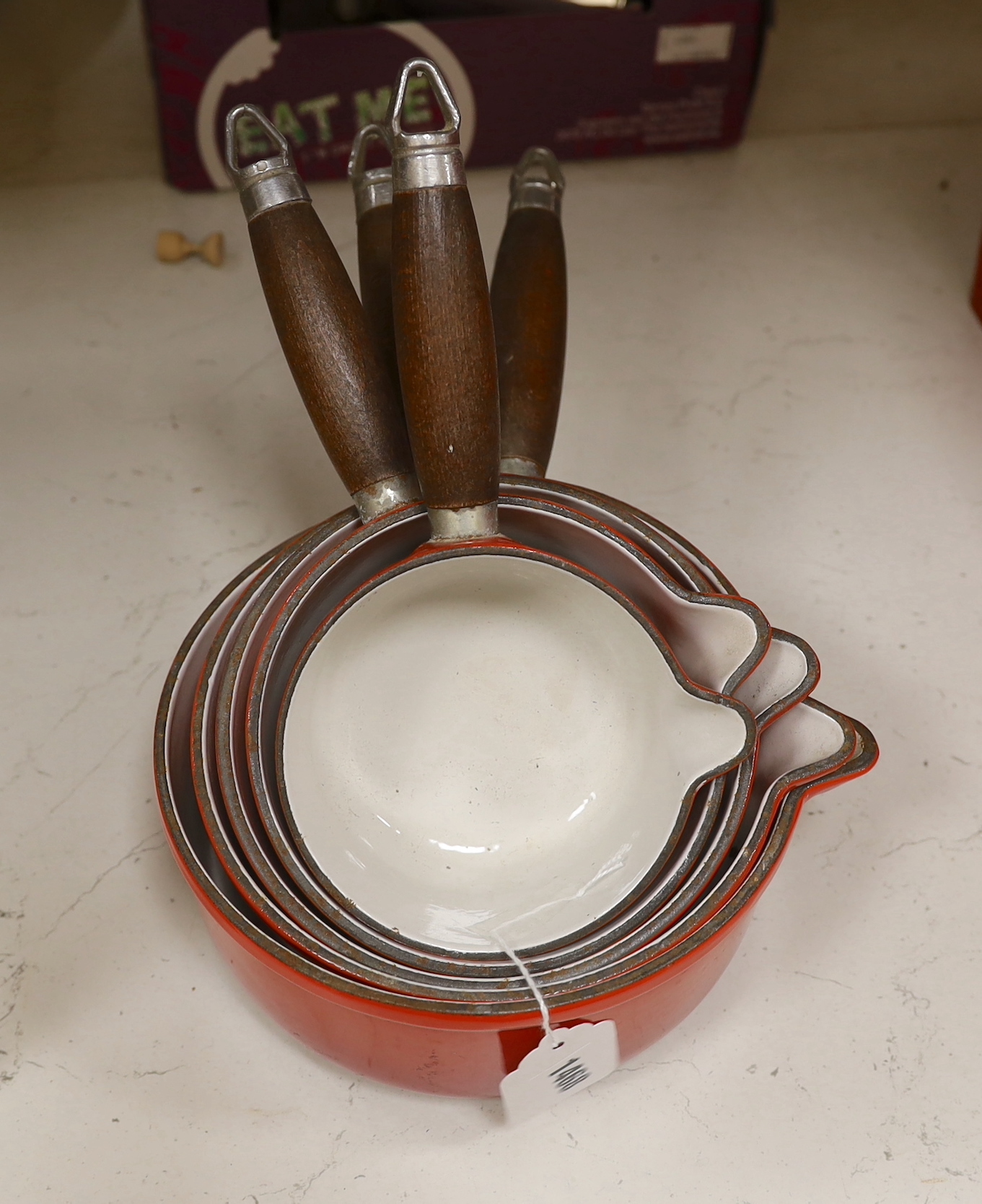 Five graduated Nomar French enamel saucepans